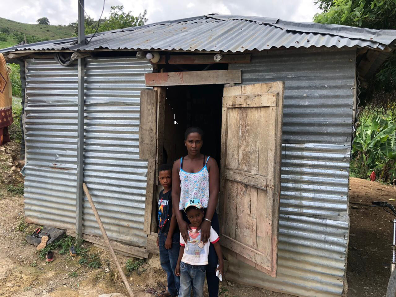Families in Las Lomas, in the sister Diocese of San Juan de la Maguana, are used to living in makeshift homes. The Mission Office now offers residents a chance for sturdy shelter. (COURTESY)